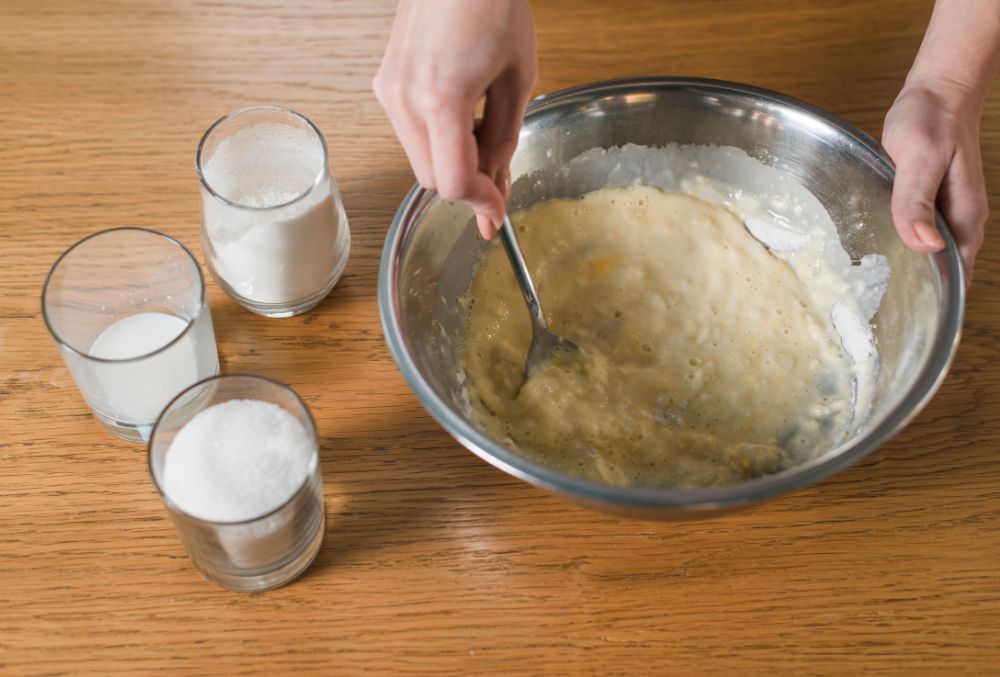 Preparing batter for pisang goreng