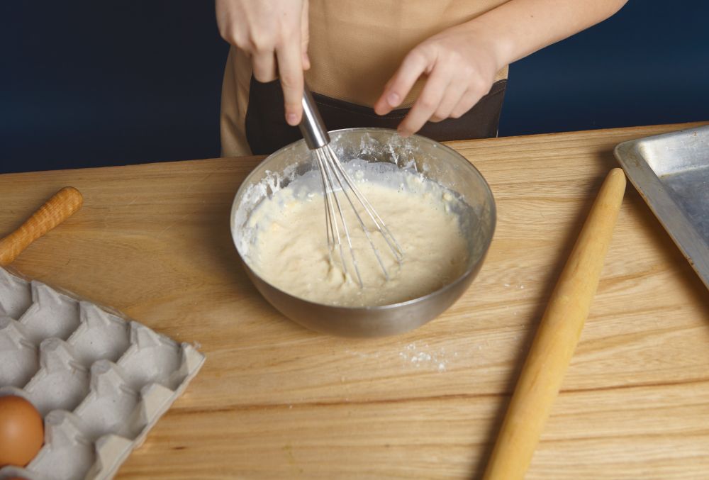 Preparing batter for pisang goreng